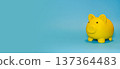 Yellow piggy bank on a bright blue background finance concept 137364483
