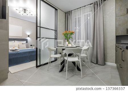 Modern Studio Interior with Dining Table and Bedroom View Modern Studio Interior with Dining Table and Bedroom View 137366337