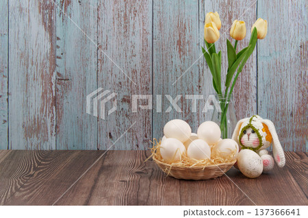 Easter bunny with white eggs and tulips in vase Easter bunny with white eggs and tulips in vase 137366641