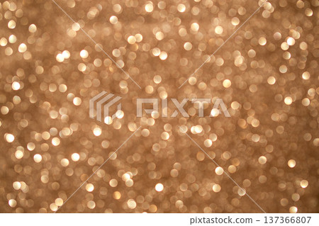 Gold bokeh glitter background with warm shimmer and soft sparkle for festive luxury and celebration designs Gold bokeh glitter background with warm shimmer and soft sparkle for festive luxury and celebration designs 137366807