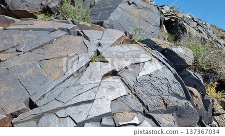 Texture of stones. Stones with petroglyphs. Texture of stones. Stones with petroglyphs. 137367034