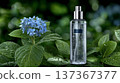 Hydrating Facial Mist Bottle on Fresh Green Leaves and Blue Hydrangea Flowers with Water Droplets in 137367377