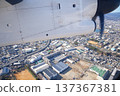 Aerial view of the city from the window of a propeller plane 137367381