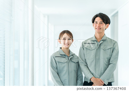 Work clothes, male and female factory workers wearing work clothes 137367408