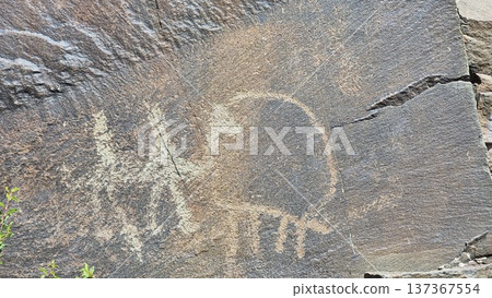Rocks in the mountains. Stones with petroglyphs. Rocks in the mountains. Stones with petroglyphs. 137367554
