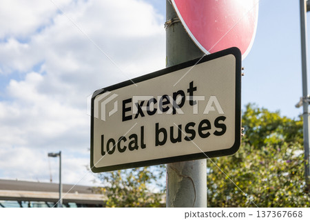 Except local buses traffic sign on a city street pole 137367668