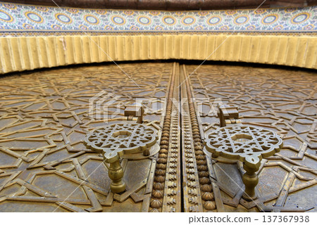 Brass doors adorned with Moroccan patterns, metal filigree, and intricate relief work. Royal Palace, Fez, Morocco 137367938