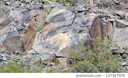 Stones with petroglyphs. Stone background texture. Stones with petroglyphs. Stone background texture. 137367976