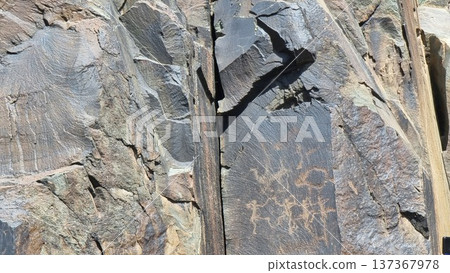 Stone texture. Stones with petroglyphs. Stone texture. Stones with petroglyphs. 137367978