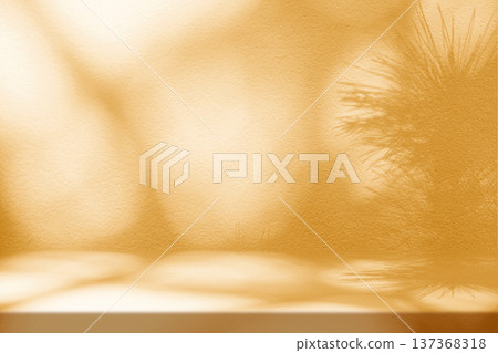 Fortuna Gold Stucco Table with Nature Shadow on Concrete Wall Background Fortuna Gold Stucco Table with Nature Shadow on Concrete Wall Background 137368318