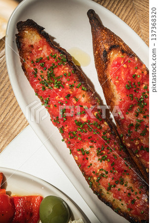 Grilled tomato bruschetta with green onions Grilled tomato bruschetta with green onions 137368320