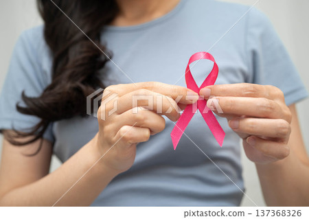 Asian woman with pink ribbon, World Breast Cancer Day at October. 137368326