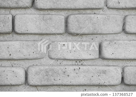 A clean, flat lay close-up of a white decorative brick wall with grey grout, creating a minimalist and industrial architectural pattern. A clean, flat lay close-up of a white decorative brick wall with grey grout, creating a minimalist and industrial architectural pattern. 137368527