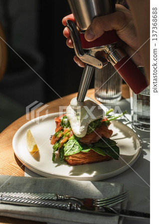 Salmon toast with poached egg and spinach 137368688