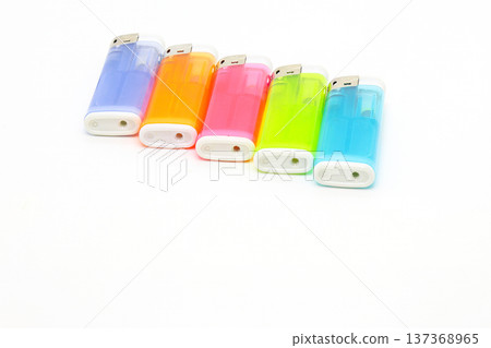 Colorful disposable lighters lined up on a white background_bottom margin Colorful disposable lighters lined up on a white background_bottom margin 137368965