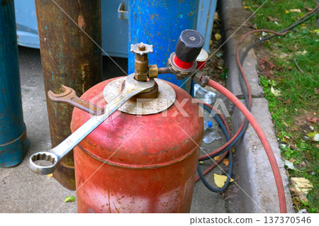 Cylinders with flammable gas and oxygen for welding and cutting metal 137370546