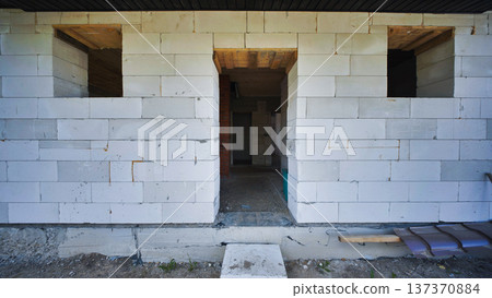 Unfinished doorway in a house under construction made of aerated concrete blocks Unfinished doorway in a house under construction made of aerated concrete blocks 137370884