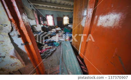 Abandoned living room depicting extreme hoarding, disarray, and poverty Abandoned living room depicting extreme hoarding, disarray, and poverty 137370907