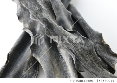 Dried kelp photographed on a white background Dried kelp photographed on a white background 137370945