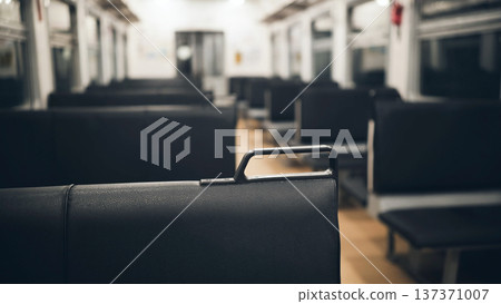 Empty train car interior with black seats for public transportation and commute Empty train car interior with black seats for public transportation and commute 137371007