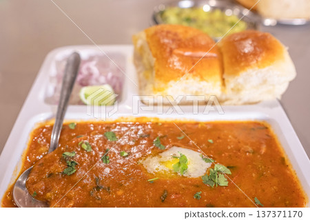 Pav Bhaji Indian spicy fast food with bread, onion and butter, Indian food, Mumbai food Pav Bhaji Indian spicy fast food with bread, onion and butter, Indian food, Mumbai food 137371170