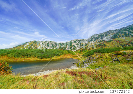 Early autumn mountain range seen from Midorigaike Pond in Mt. Tateyama Early autumn mountain range seen from Midorigaike Pond in Mt. Tateyama 137372142