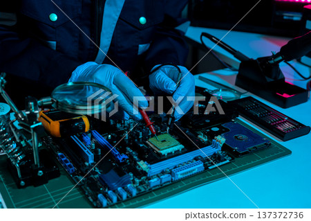 Macro photo of a finger touching a laptop chip close up Macro photo of a finger touching a laptop chip close up 137372736