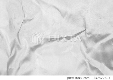 Crumpled shiny silver fabric metal texture background Crumpled shiny silver fabric metal texture background 137372804