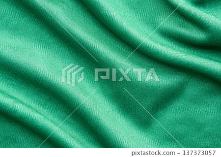 Green sports clothing fabric football shirt jersey texture close up 137373057