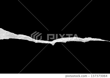 Ripped torn paper edges isolated on black background 137373064