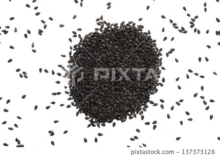 Black sesame seeds isolated on white background Black sesame seeds isolated on white background 137373128