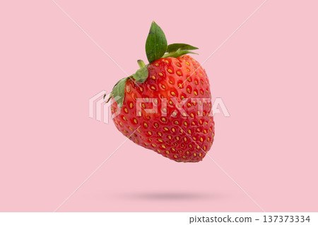 Fresh strawberry floated on pink background close up 137373334