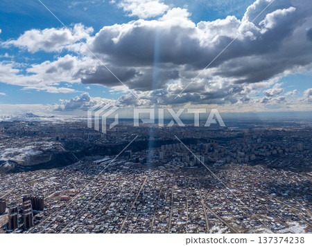 Aerial view of a sprawling city in winter 137374238