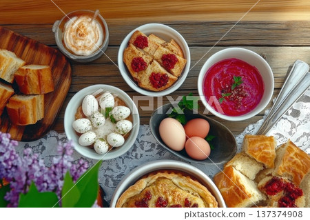 Assorted Easter brunch dishes with pastries, eggs, and berry sauce Assorted Easter brunch dishes with pastries, eggs, and berry sauce 137374908