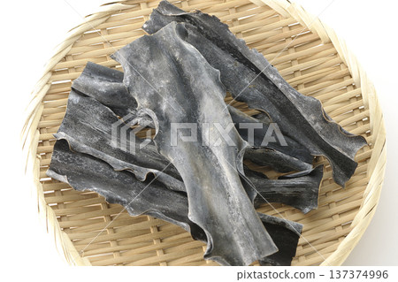 Dried kelp on a basket photographed against a white background Dried kelp on a basket photographed against a white background 137374996