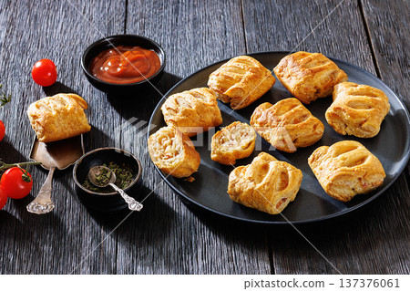 Top view of puff pastry rolls with ham and cheese Top view of puff pastry rolls with ham and cheese 137376061