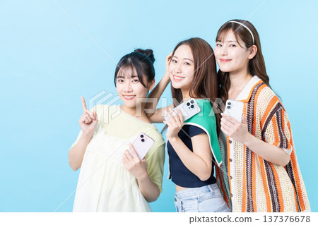 Young girl with smartphone Young girl with smartphone 137376678