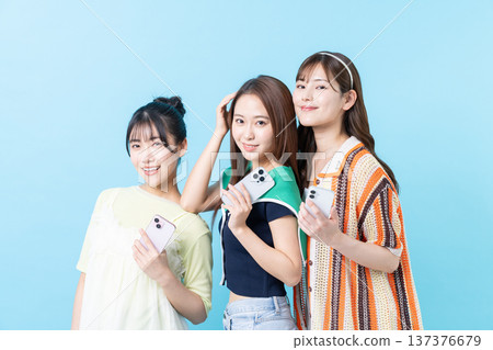 Young girl with smartphone Young girl with smartphone 137376679