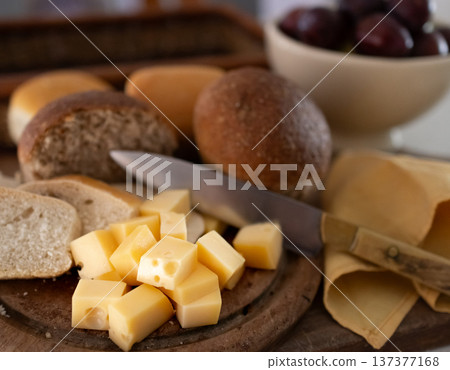 Cheese cubes and black and white breads for a delicius appetizer 137377168