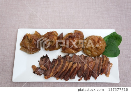 duck goose legs roasted with apples, oranges and spices. Thanksgiving meal with harvest table settings duck goose legs roasted with apples, oranges and spices. Thanksgiving meal with harvest table settings 137377716
