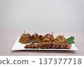 duck goose Steak with chopped apples and cinnamon in a blue plate on a white background. A festive dish with a spicy taste 137377718