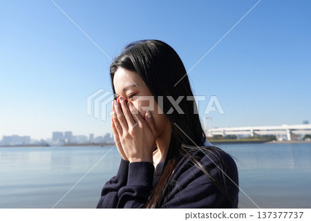 Young woman with stressed expression Young woman with stressed expression 137377737