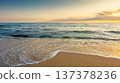sandy sea beach background on hot summer dawn. low angle view. empty seascape scenery with calm waves. beauty seashore wallpaper. peaceful sozopol resort bay photo for advertising 137378236
