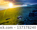 alpine mountain landscape. day and night time change concept. untouched grass and sharp sandstone on wide meadow with sun and moon. travel background for summer solstice. rolling astrology wallpaper 137378240