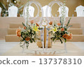 Elegant Acrylic Wedding Chairs with Floral Arrangements for Modern Ceremony Decor 137378310