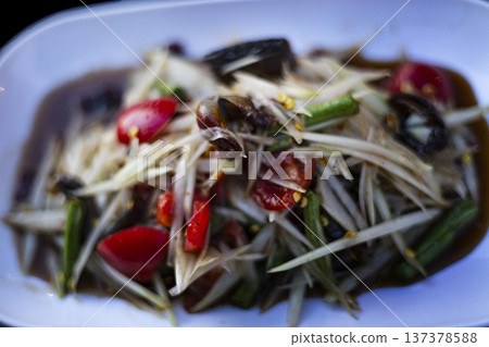 Spicy Papaya Salad With Crab And Fish Sauce On Table, Vibrant Thai som tum topped with fresh crab and fish sauce, showcasing bold flavors and authentic street food culture and food advertising. 137378588