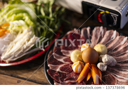 Thai Shabu Beef And Pork Set, A vibrant photo of Thai shabu set with fresh sliced beef and pork, showcasing ingredients and authentic dining culture, for food advertising and restaurant promotion. Thai Shabu Beef And Pork Set, A vibrant photo of Thai shabu set with fresh sliced beef and pork, showcasing ingredients and authentic dining culture, for food advertising and restaurant promotion. 137378696