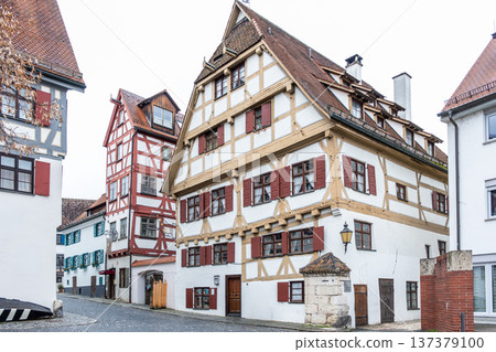 Historic Zunfthaus der Schiffleute, a traditional guildhouse in Ulm, Germany. Features half-timbered architecture with a sloped roof and decorative windows. Historic Zunfthaus der Schiffleute, a traditional guildhouse in Ulm, Germany. Features half-timbered architecture with a sloped roof and decorative windows. 137379100