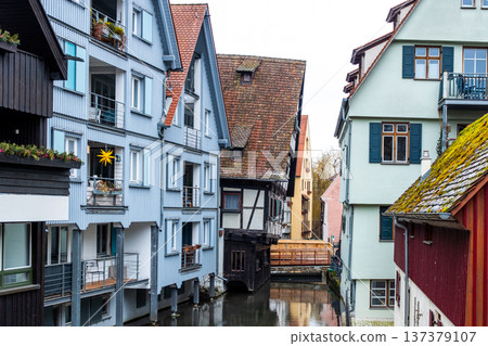 Hotel Schiefes Haus in Ulm, Germany, known for its unique crooked structure. The building features traditional timber framing and green shutters. Hotel Schiefes Haus in Ulm, Germany, known for its unique crooked structure. The building features traditional timber framing and green shutters. 137379107