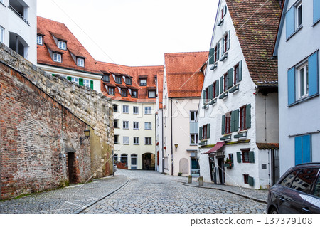 Hotel Schiefes Haus in Ulm, Germany, known for its unique crooked structure. The building features traditional timber framing and green shutters. 137379108